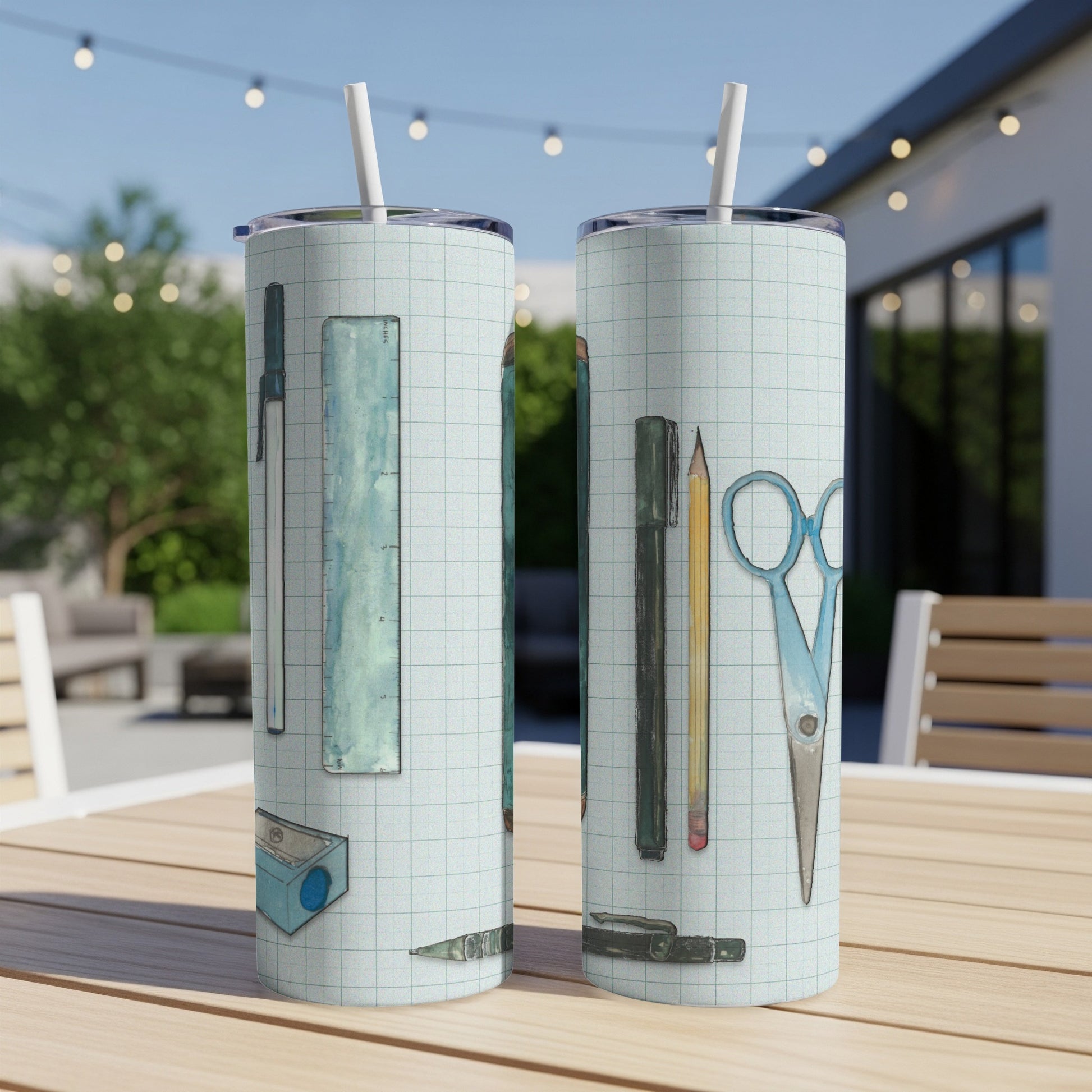 Two tumblers with a grid pattern and school supplies illustration.