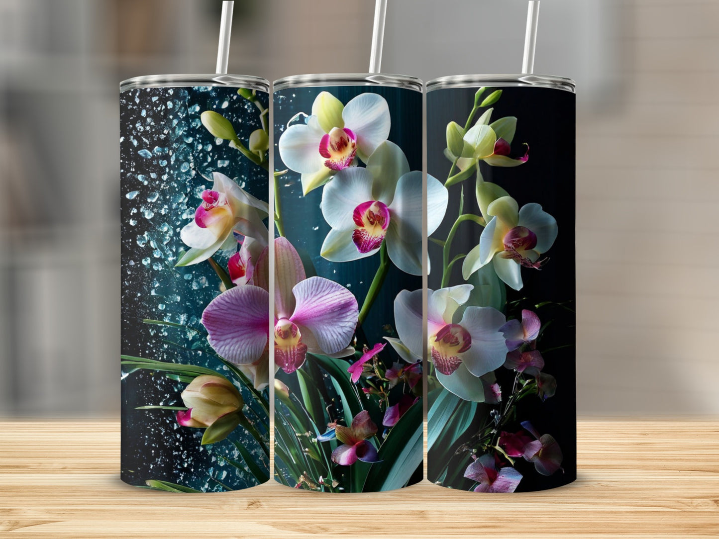 Three tumblers with a dark background and vibrant white and pink orchid designs.