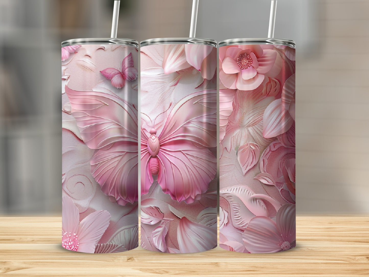 Three pink floral tumblers with embossed butterflies and flowers.