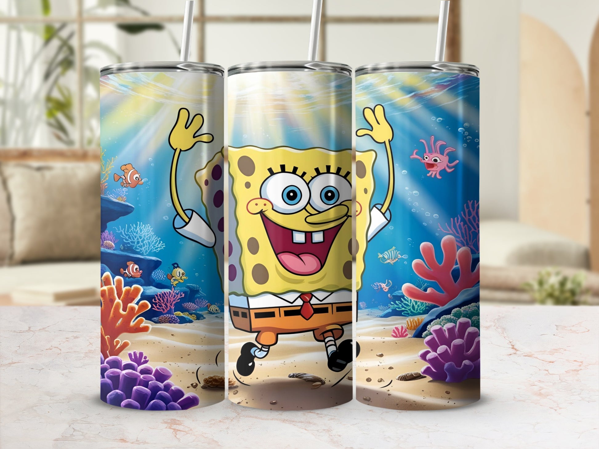 SpongeBob SquarePants underwater scene with coral and fish, shown on three tumblers.