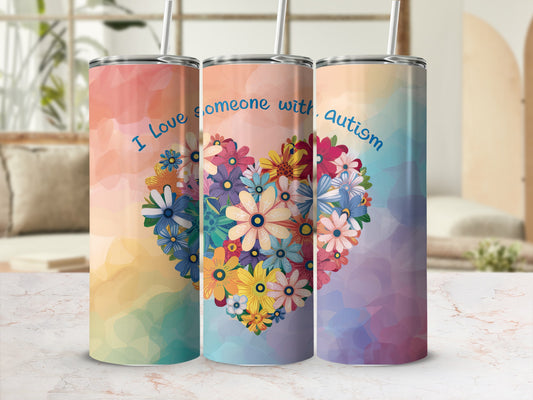 Three tumblers featuring a floral heart and text "I love someone with autism."
