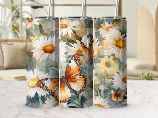 Three tumblers with a monarch butterfly and daisy floral pattern.