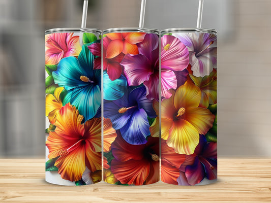 Three tumblers with vibrant hibiscus floral designs on a wooden surface.