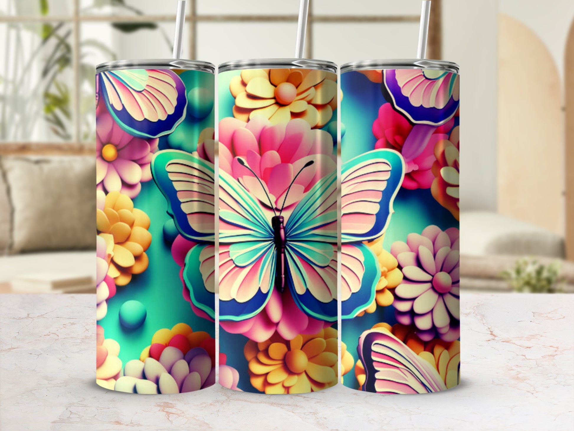 Three tumblers with a teal butterfly and floral design.