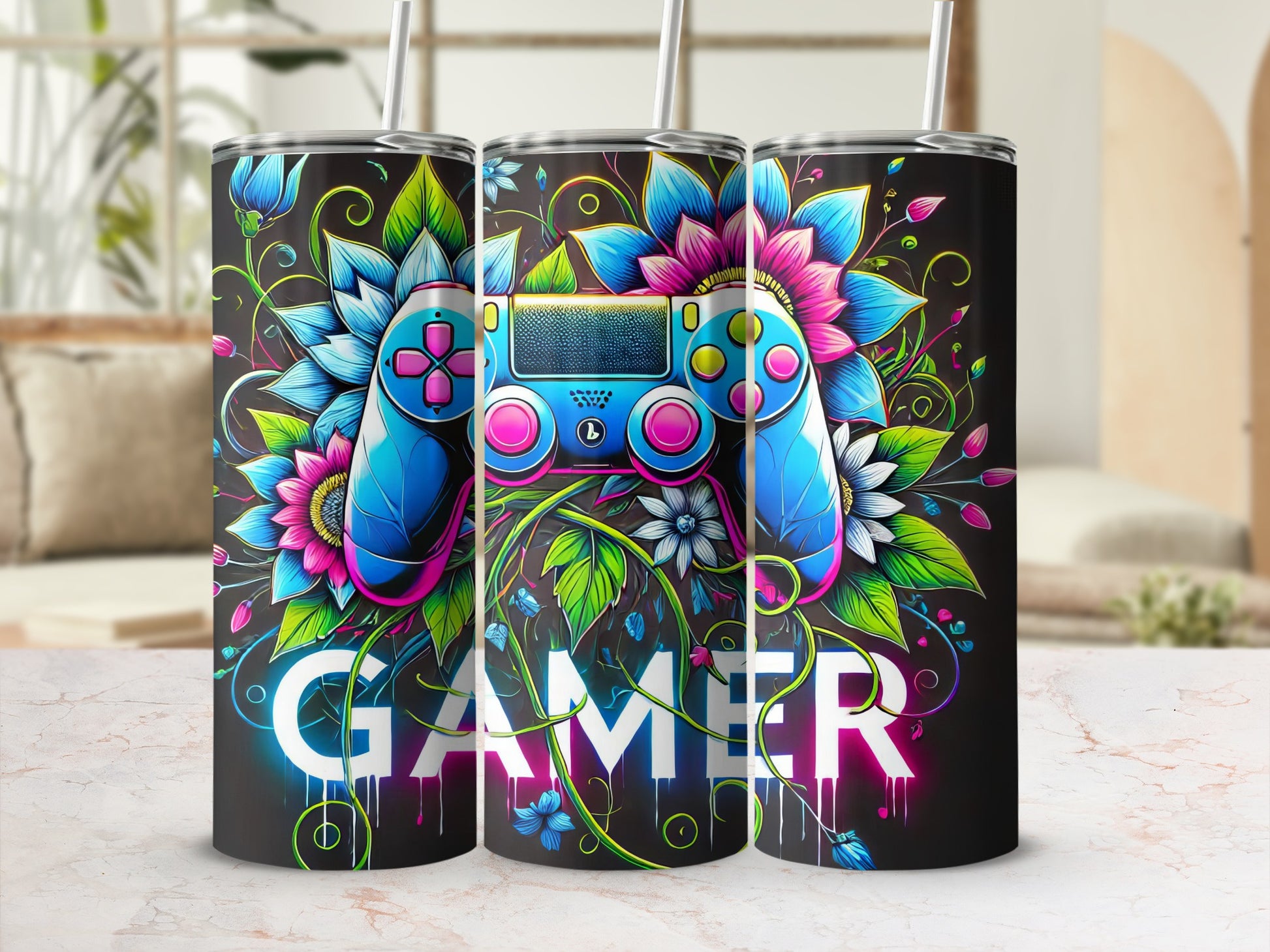 Gamer tumbler with blue and pink controller and floral accents.
