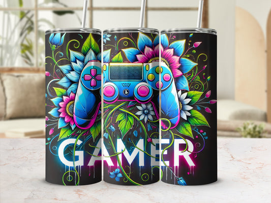 Gamer tumbler with blue and pink controller and floral accents.