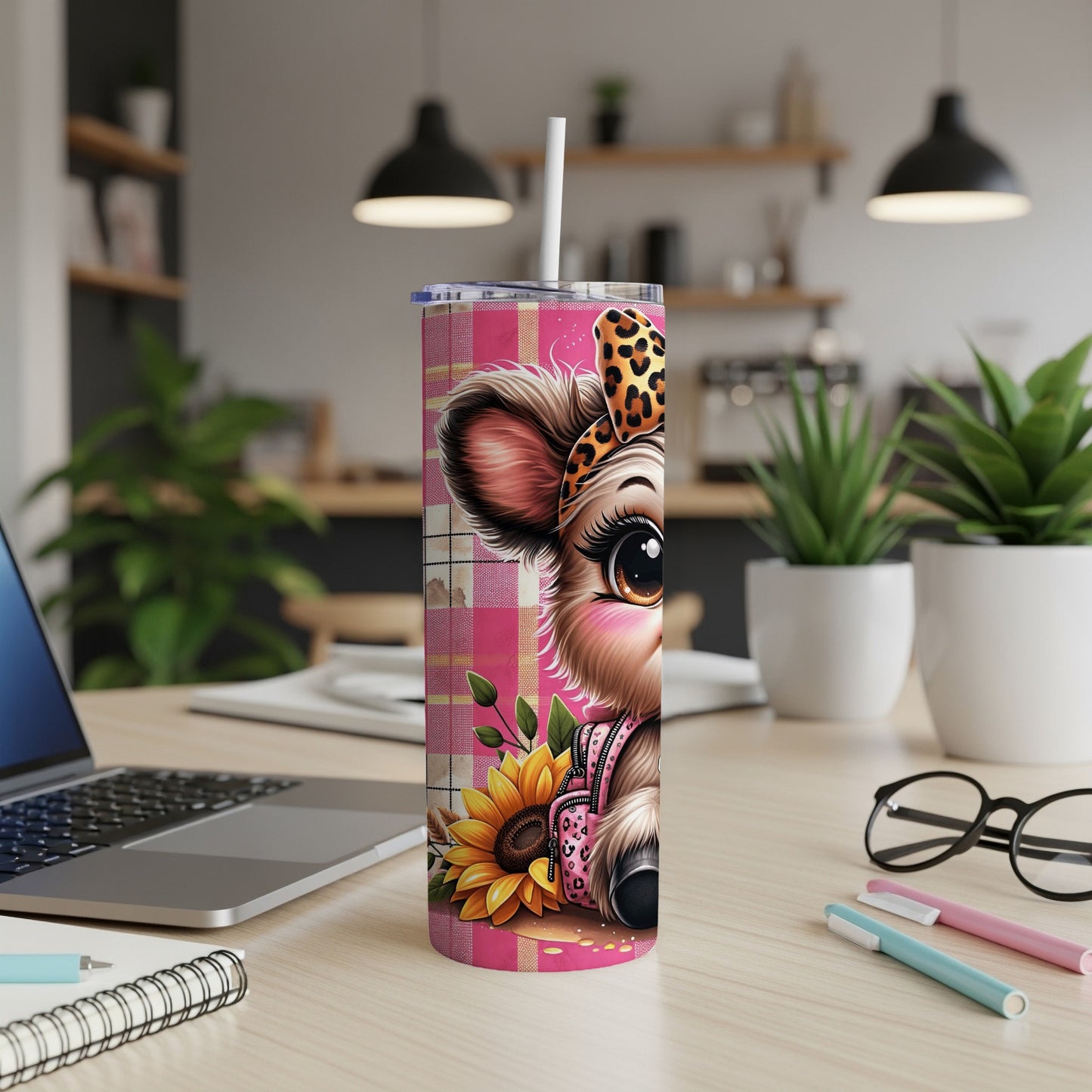 Pink plaid tumbler with cartoon cow wearing a leopard print bow.