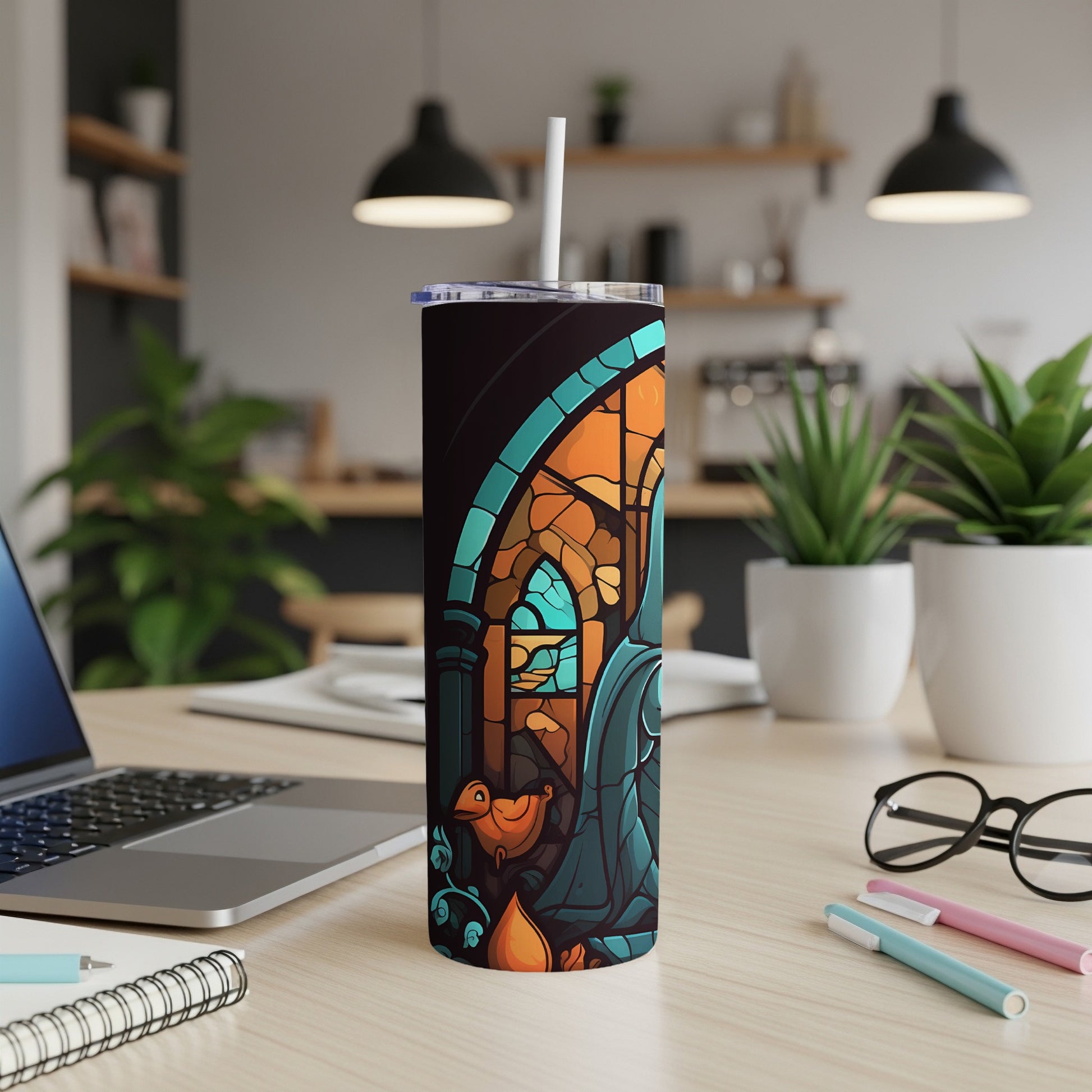 Tumbler with stained glass design featuring a bird and floral motifs.
