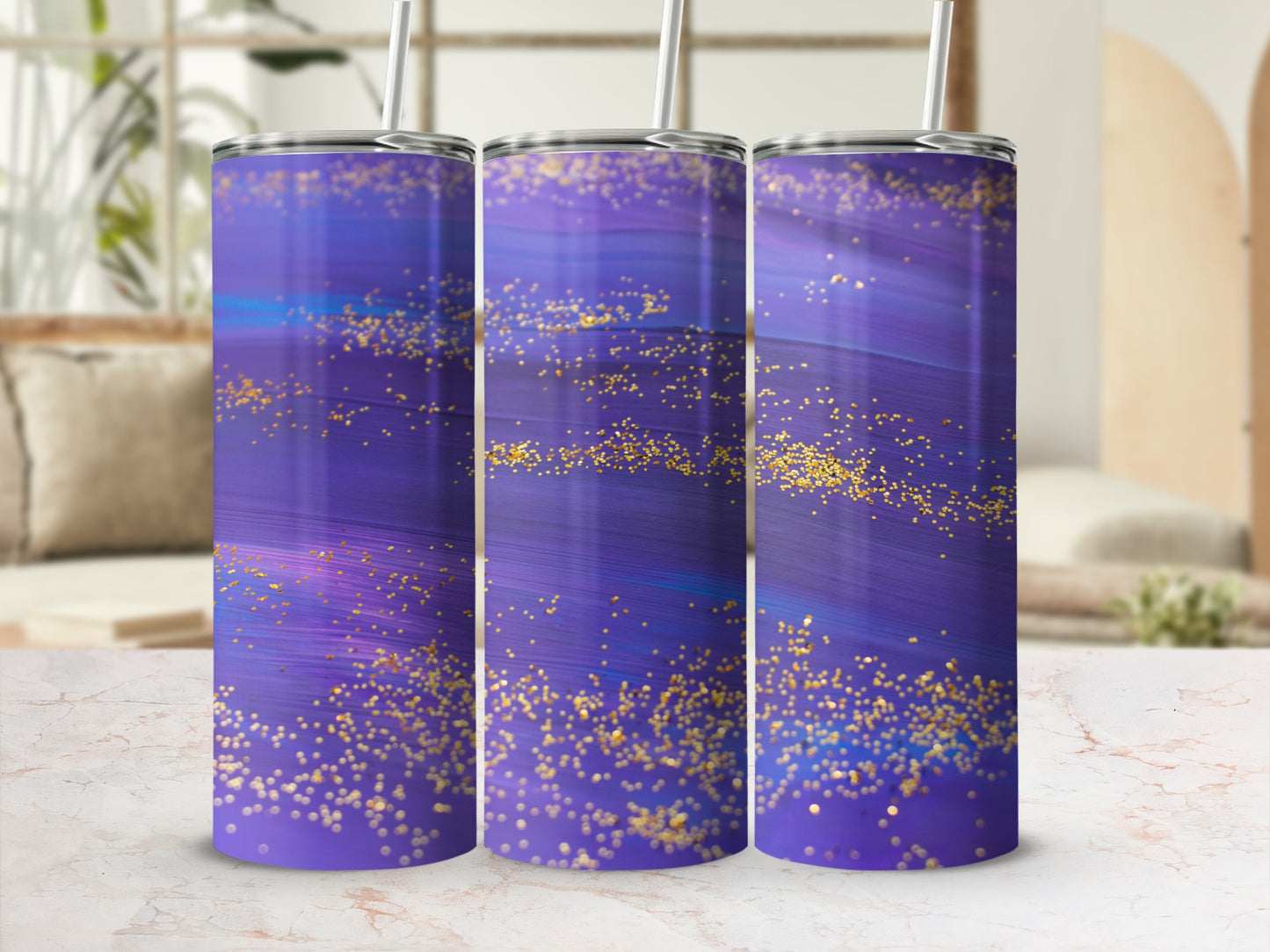 Purple marbled tumbler with gold glitter accents and straw.