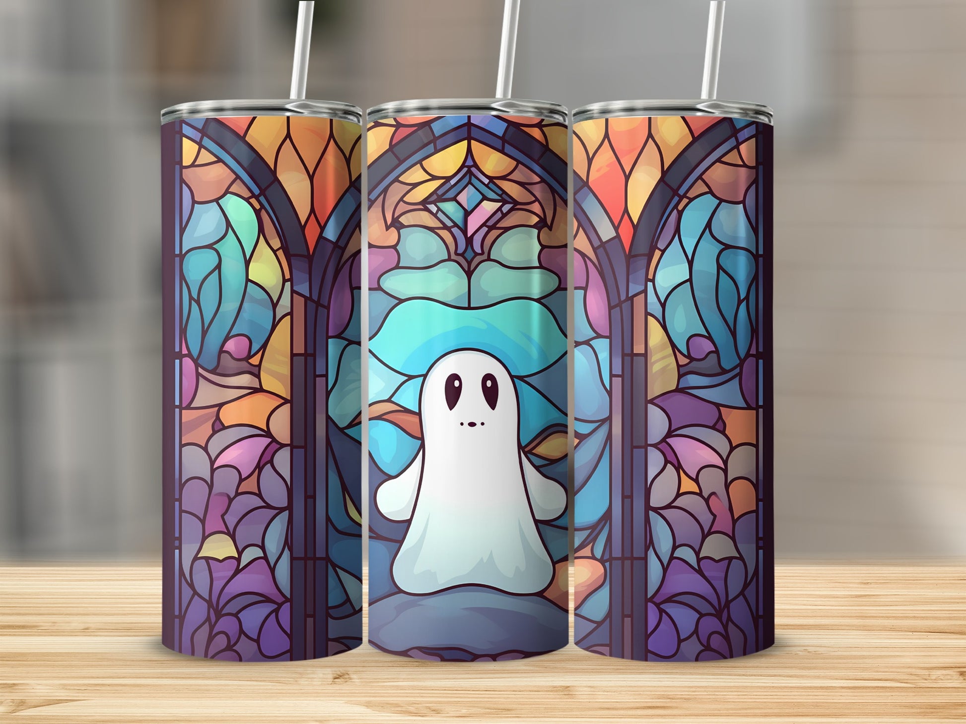 Ghost and stained glass window design on three tumblers.