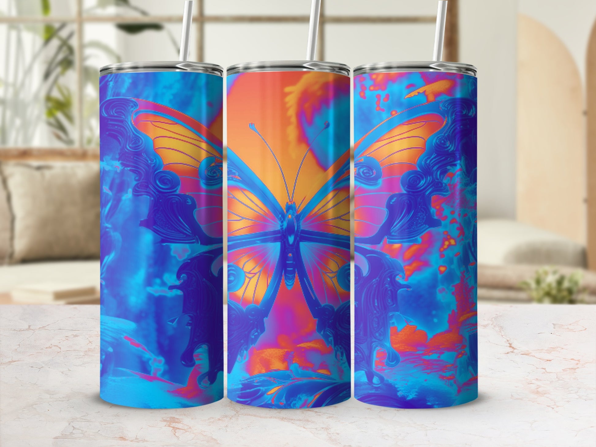 Three blue and orange gradient tumblers featuring a large butterfly design.