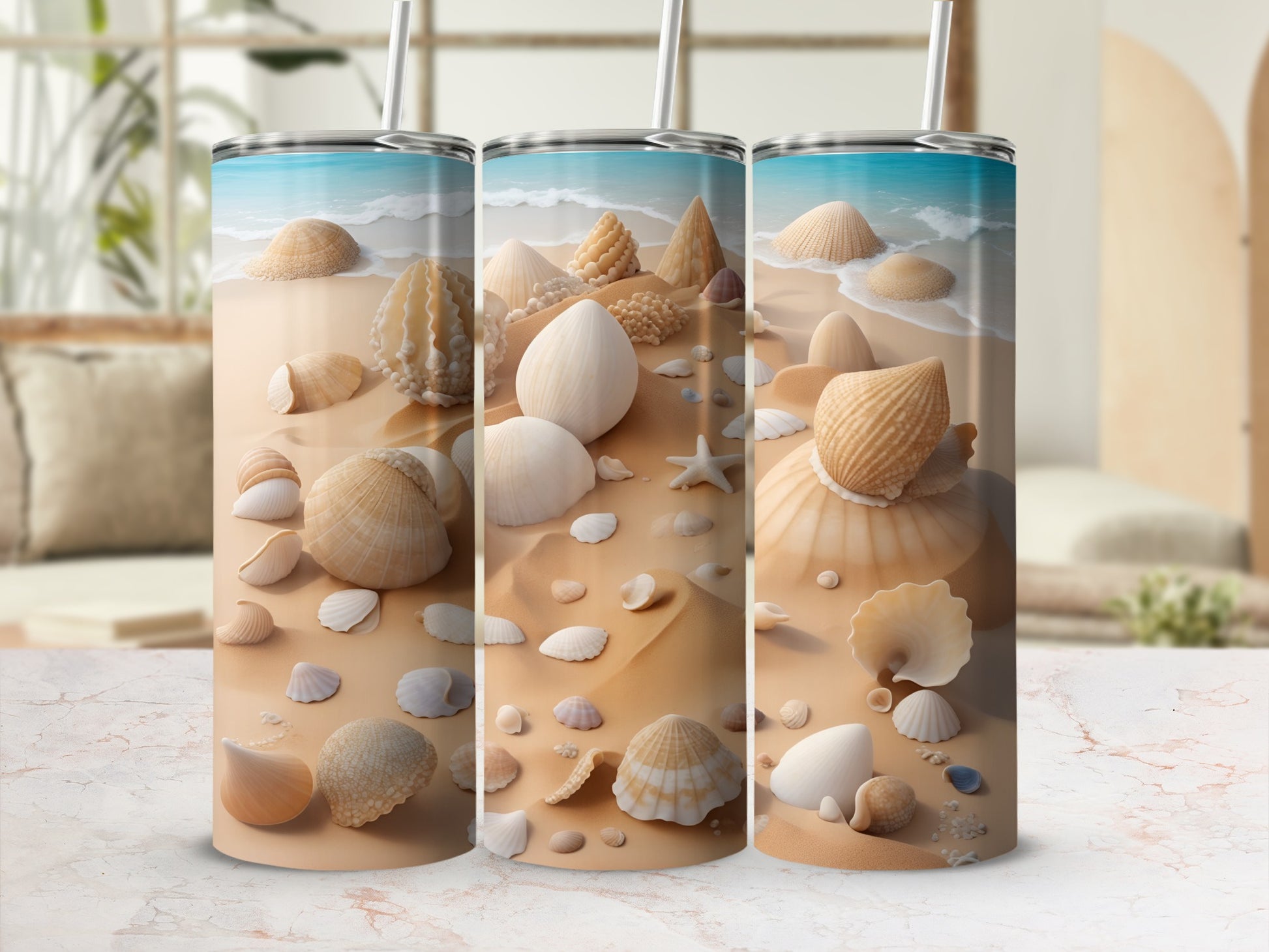 Three tumblers with seashell and beach sand design.