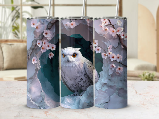 White owl with orange eyes in cave surrounded by pink cherry blossoms.
