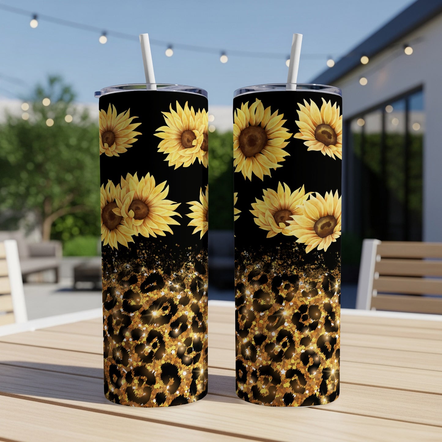 Two tumblers with sunflowers and leopard print designs sit on a table.