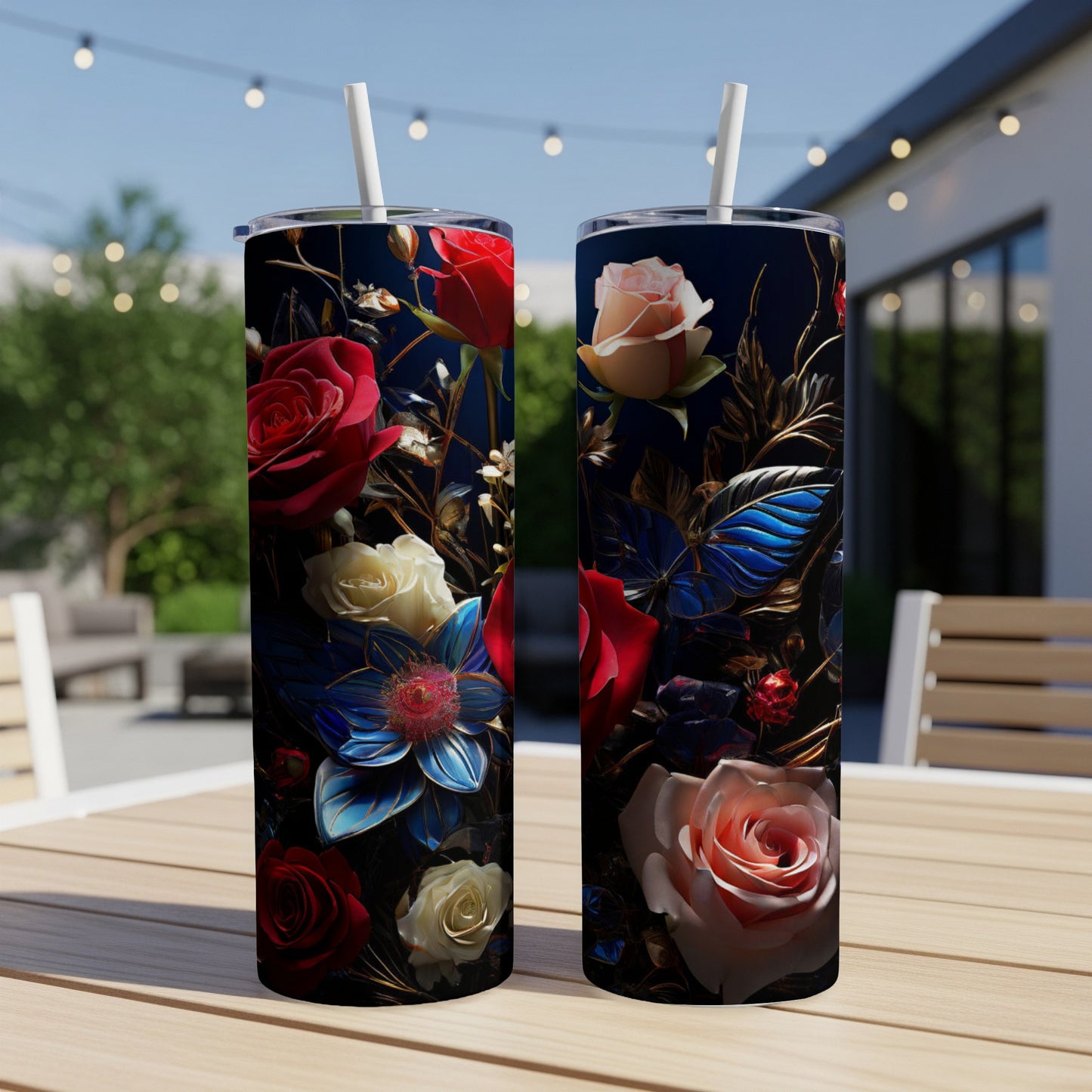 Two tumblers with floral designs sit on a wooden table.