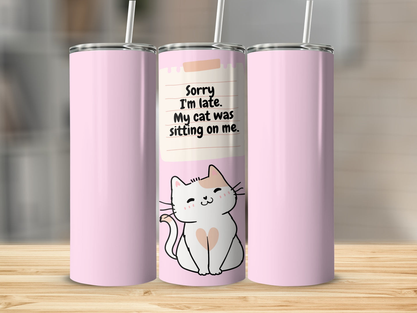 Pink tumbler with a cartoon cat and the text "Sorry I'm late. My cat was sitting on me."