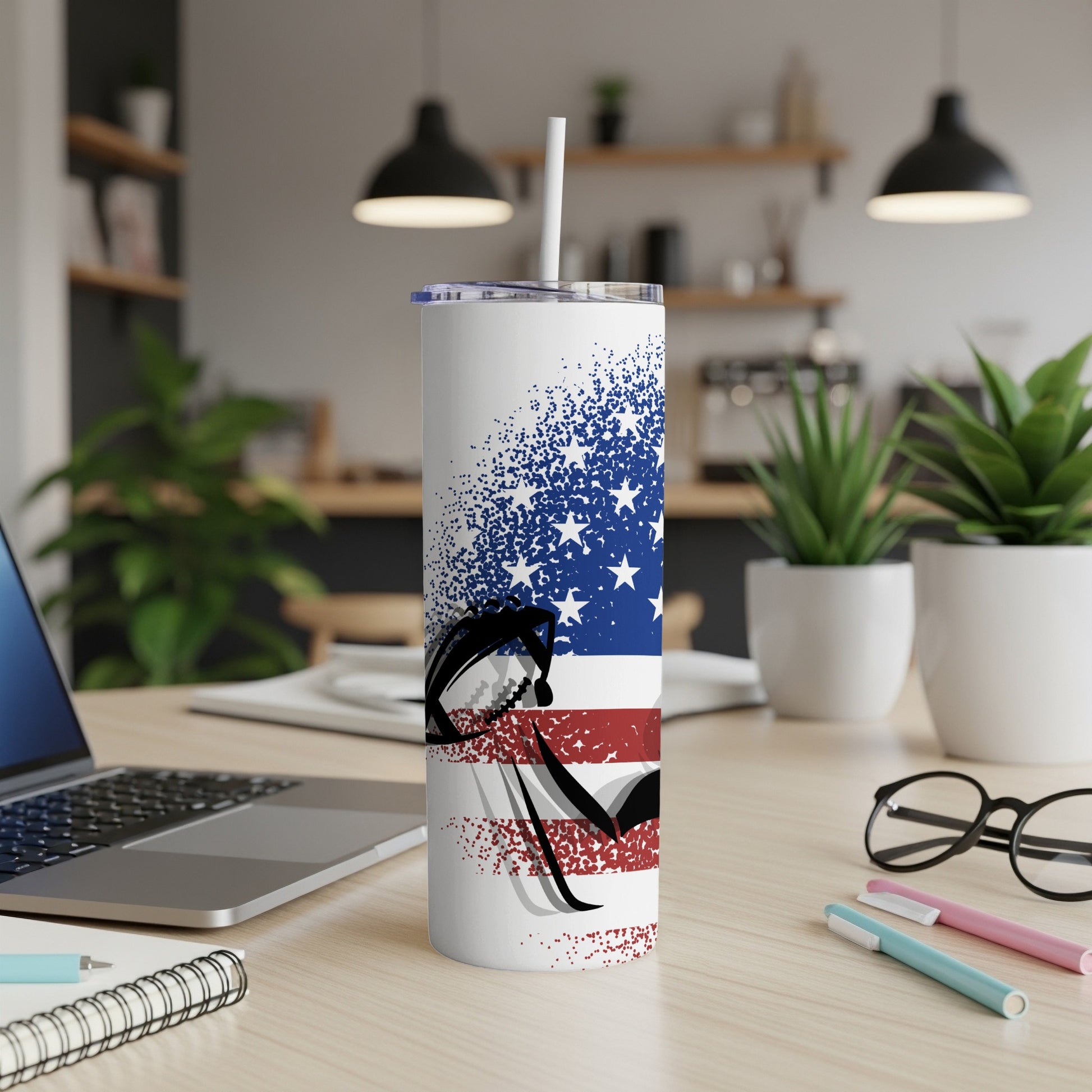 Tumbler with American flag design and football.