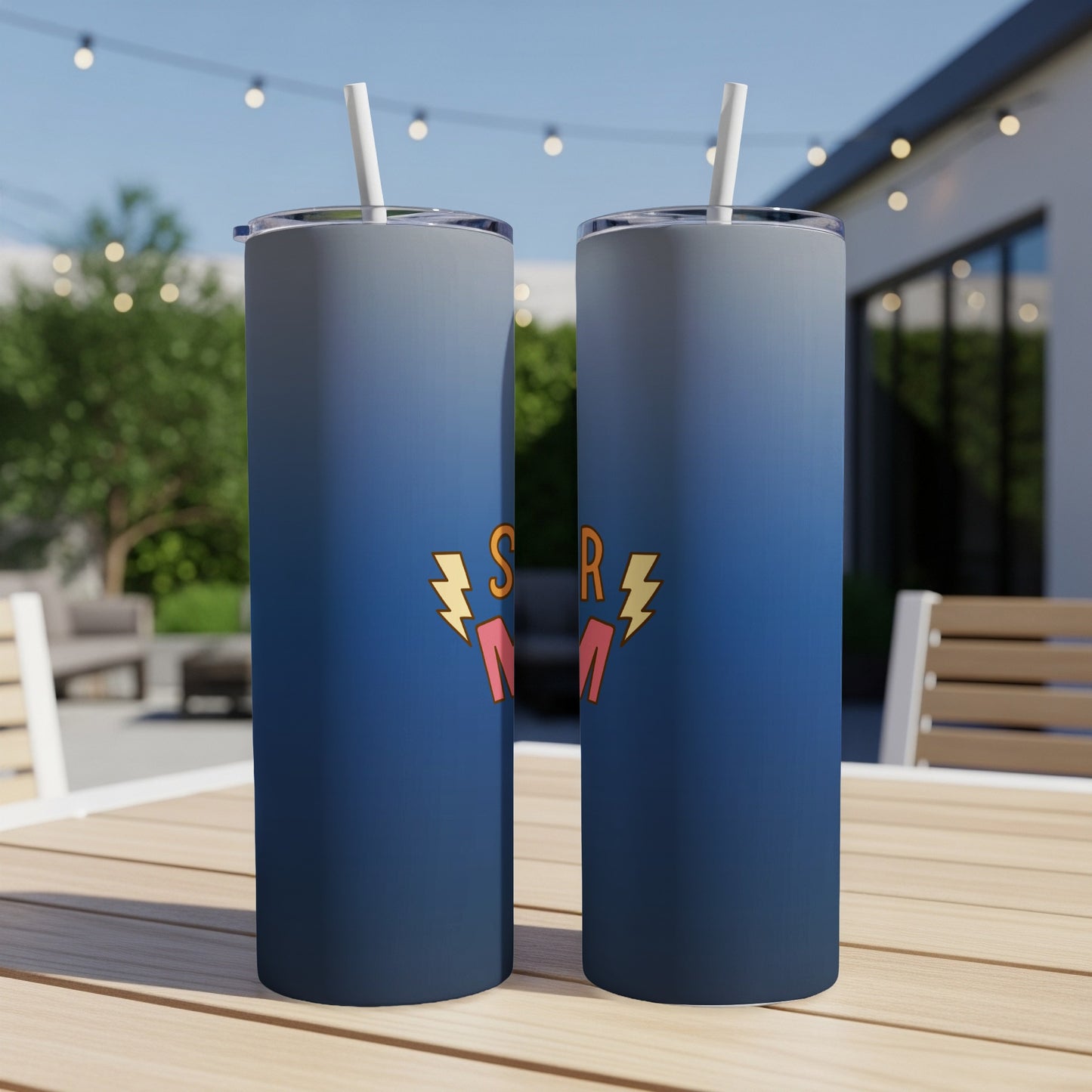 Two tall, blue ombre tumblers with "SUPER MOM" in yellow lettering and lightning bolt design.