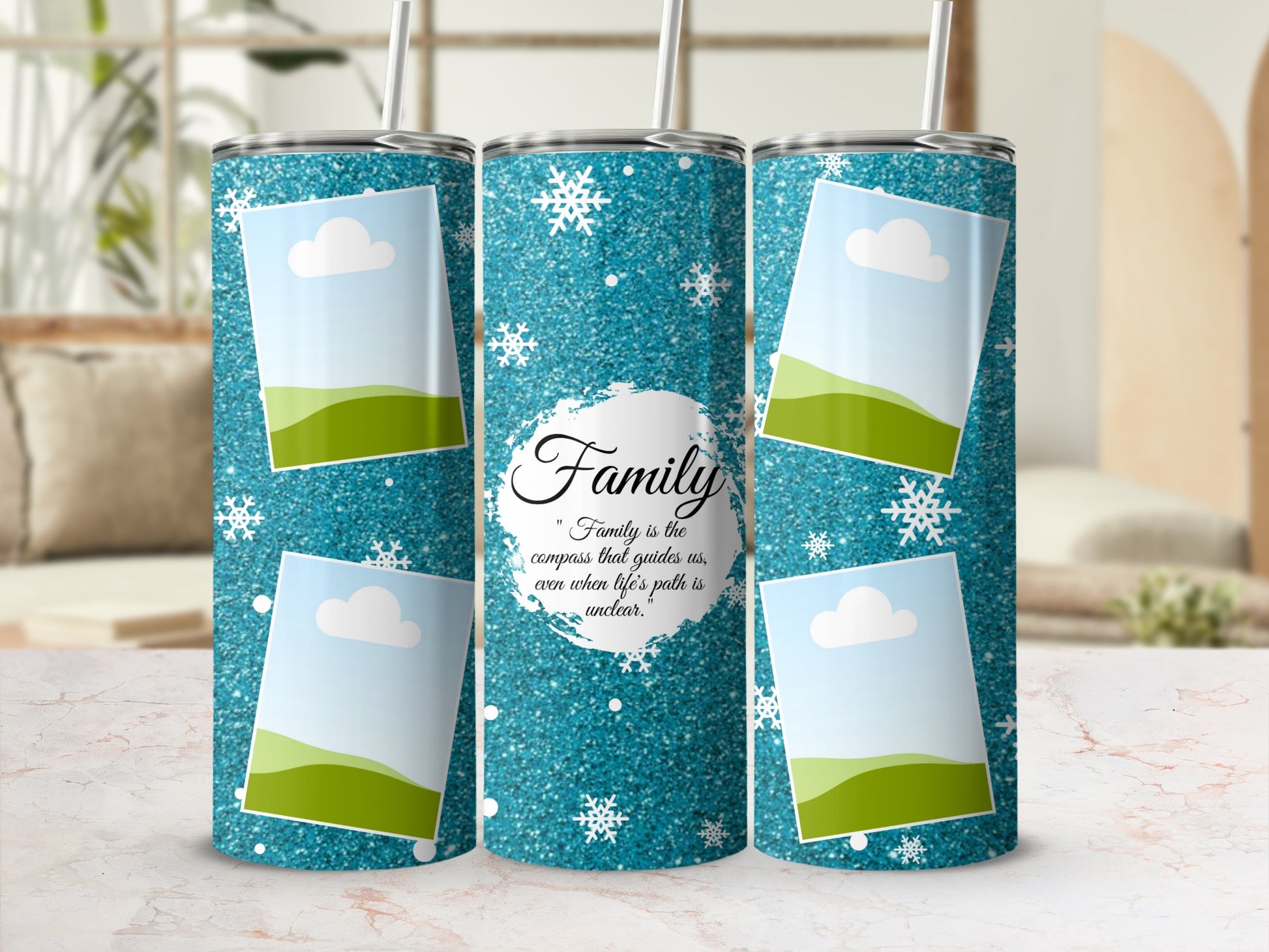 Three tumblers with glittery blue backgrounds, snowflakes, and framed landscape photos.