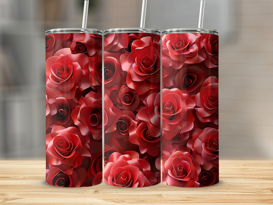 Three tumblers with red rose floral pattern on wooden surface.