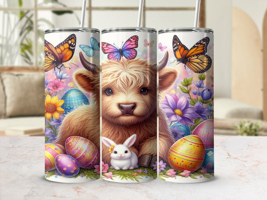 Highland cow with bunny and colorful Easter eggs, surrounded by butterflies and flowers.