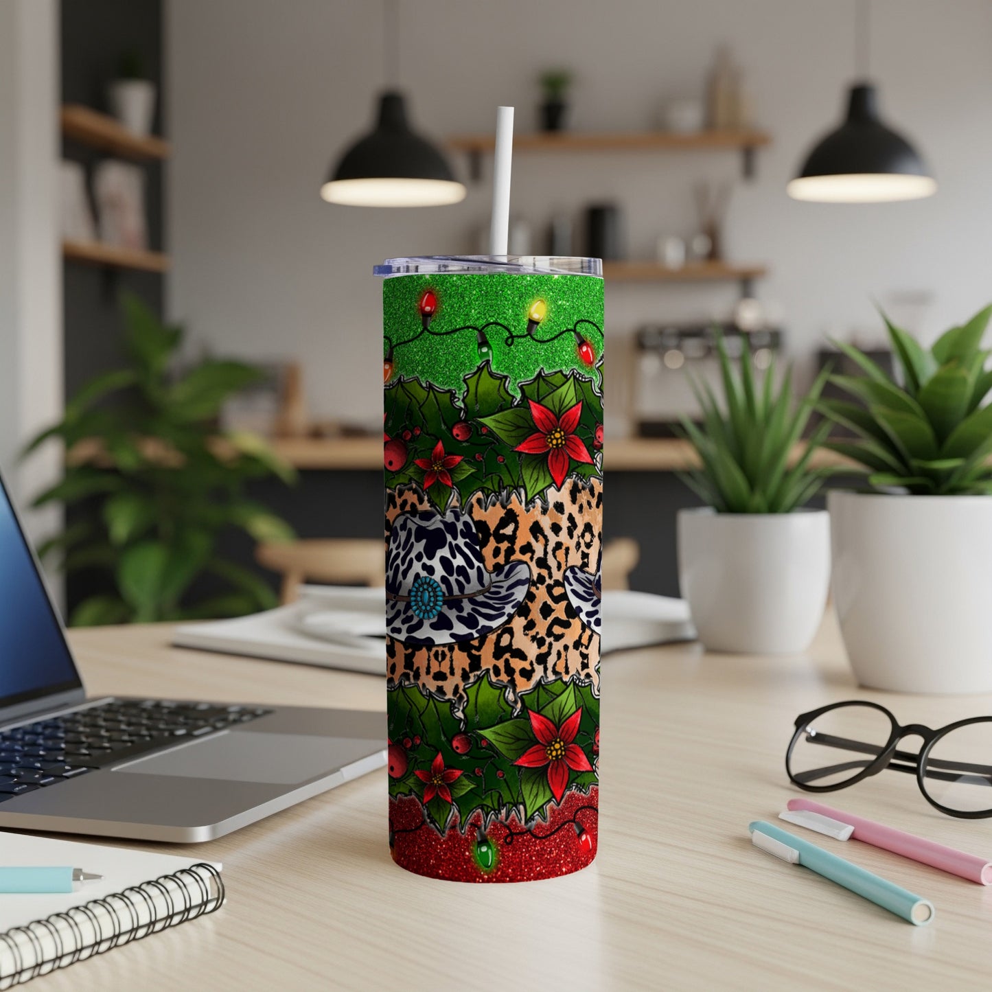 Christmas tumbler with glitter, poinsettias, leopard print, and fairy lights.