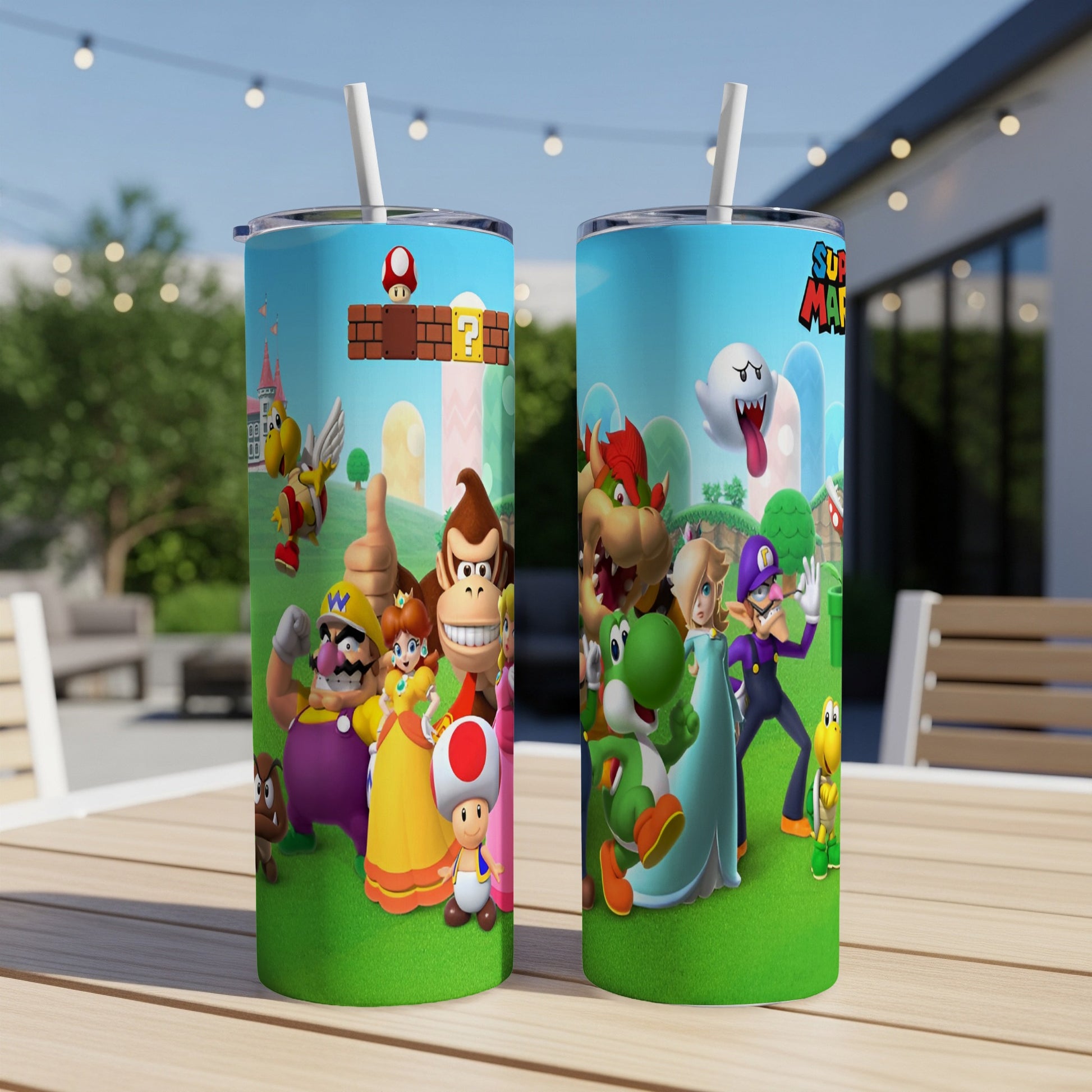 Mario characters and scenery adorn two white tumblers with straws.