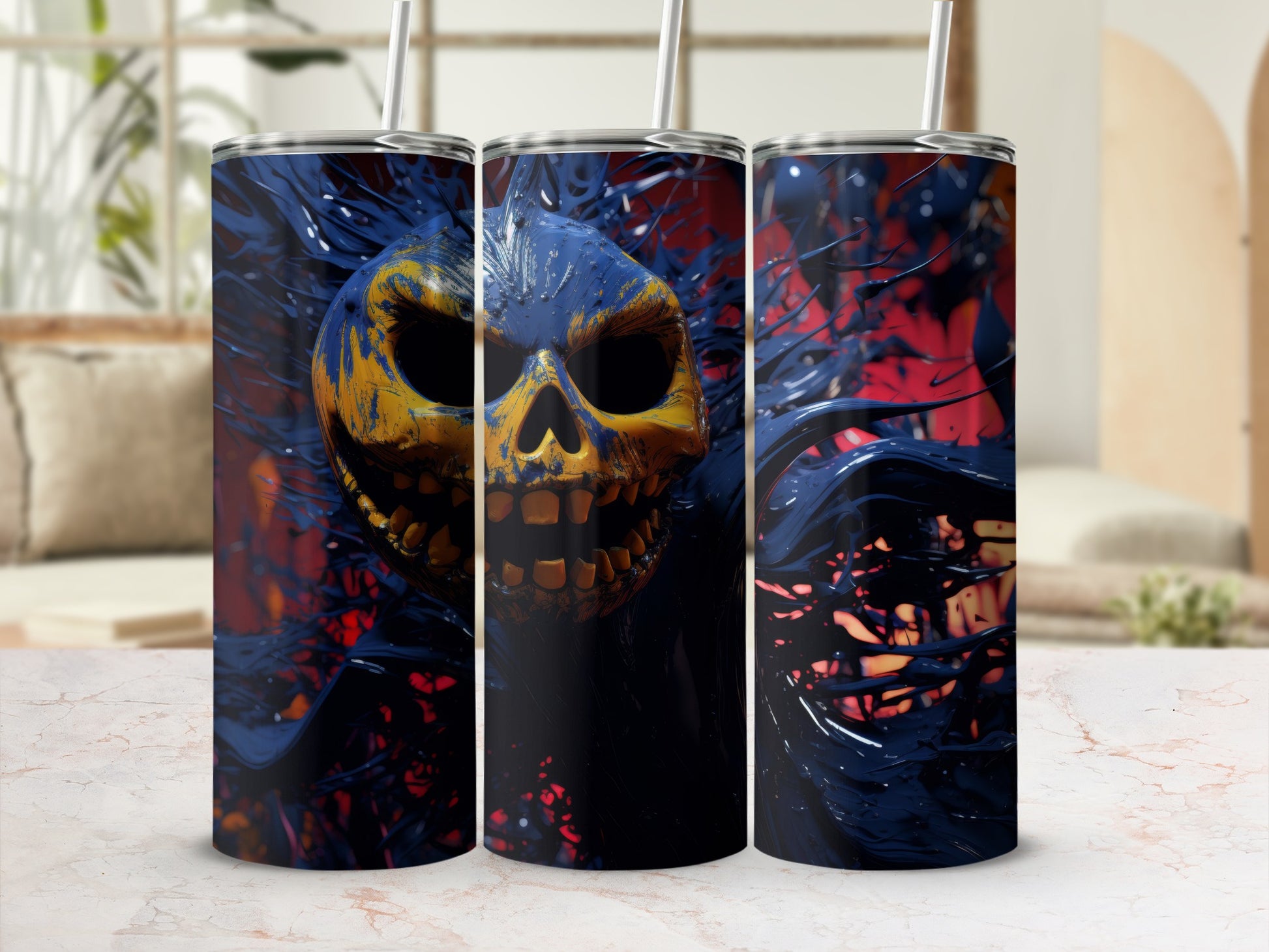 Triptych of tumblers featuring a yellow and blue skull with black liquid splatters.