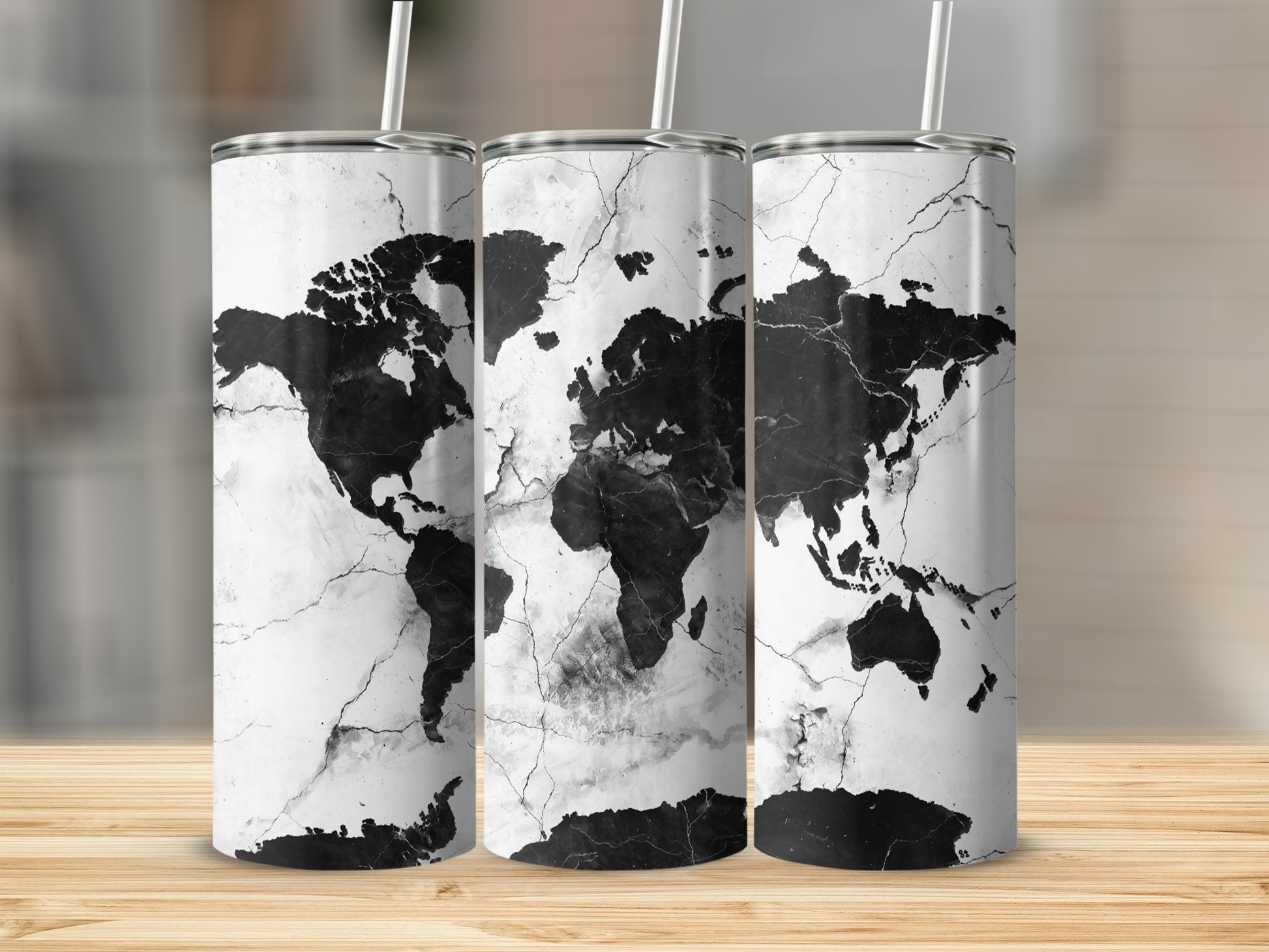 Three tumblers with a black and white cracked marble world map design.