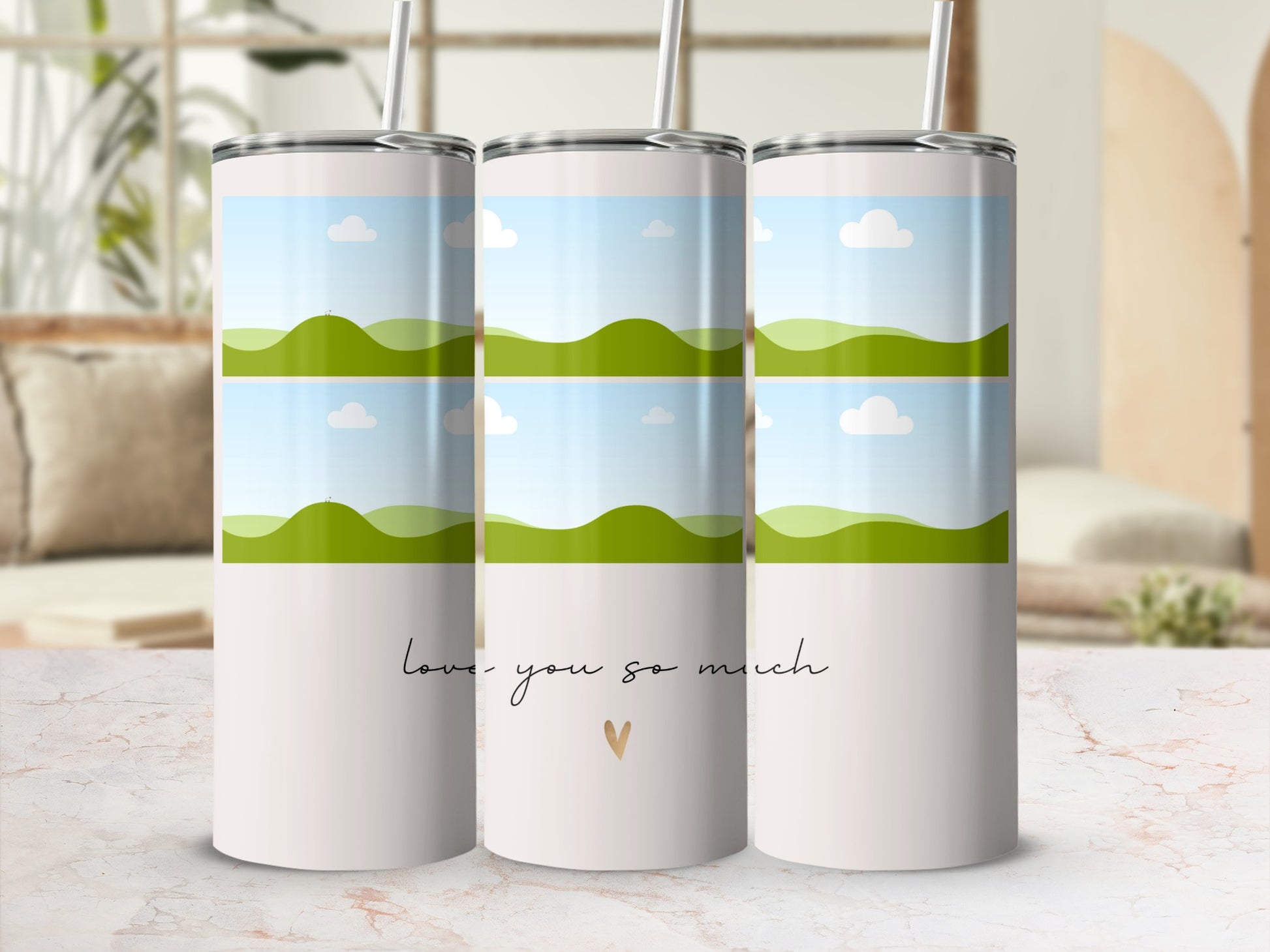 Three tumblers with a rolling green hills and sky design, text "love you so much".