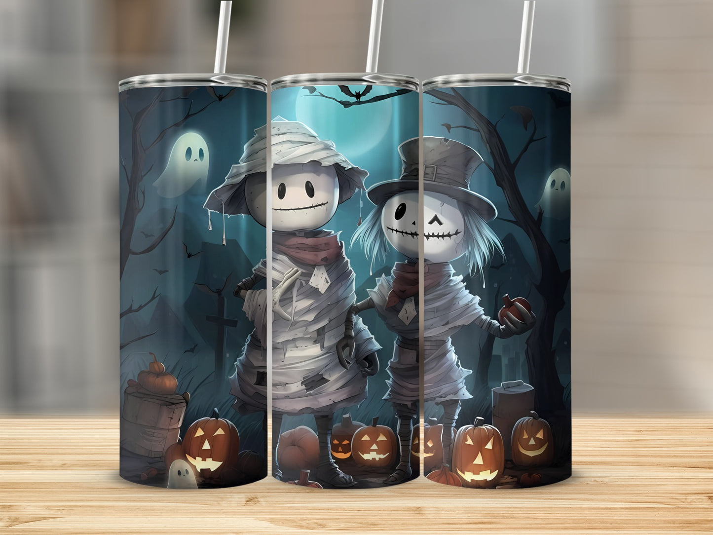 Halloween tumblers featuring mummy and skeleton figures with pumpkins and ghosts.