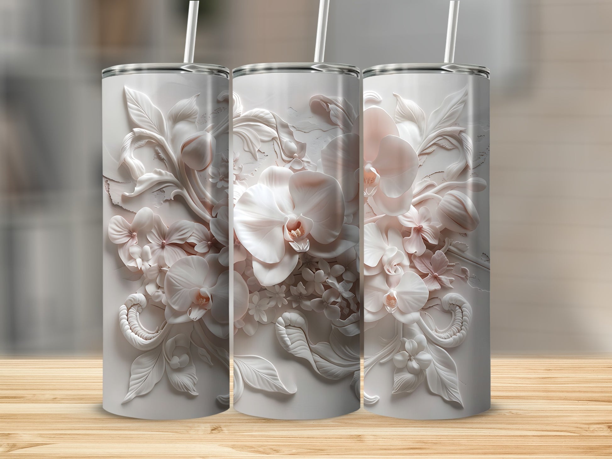 Three white tumblers with embossed floral orchid designs.