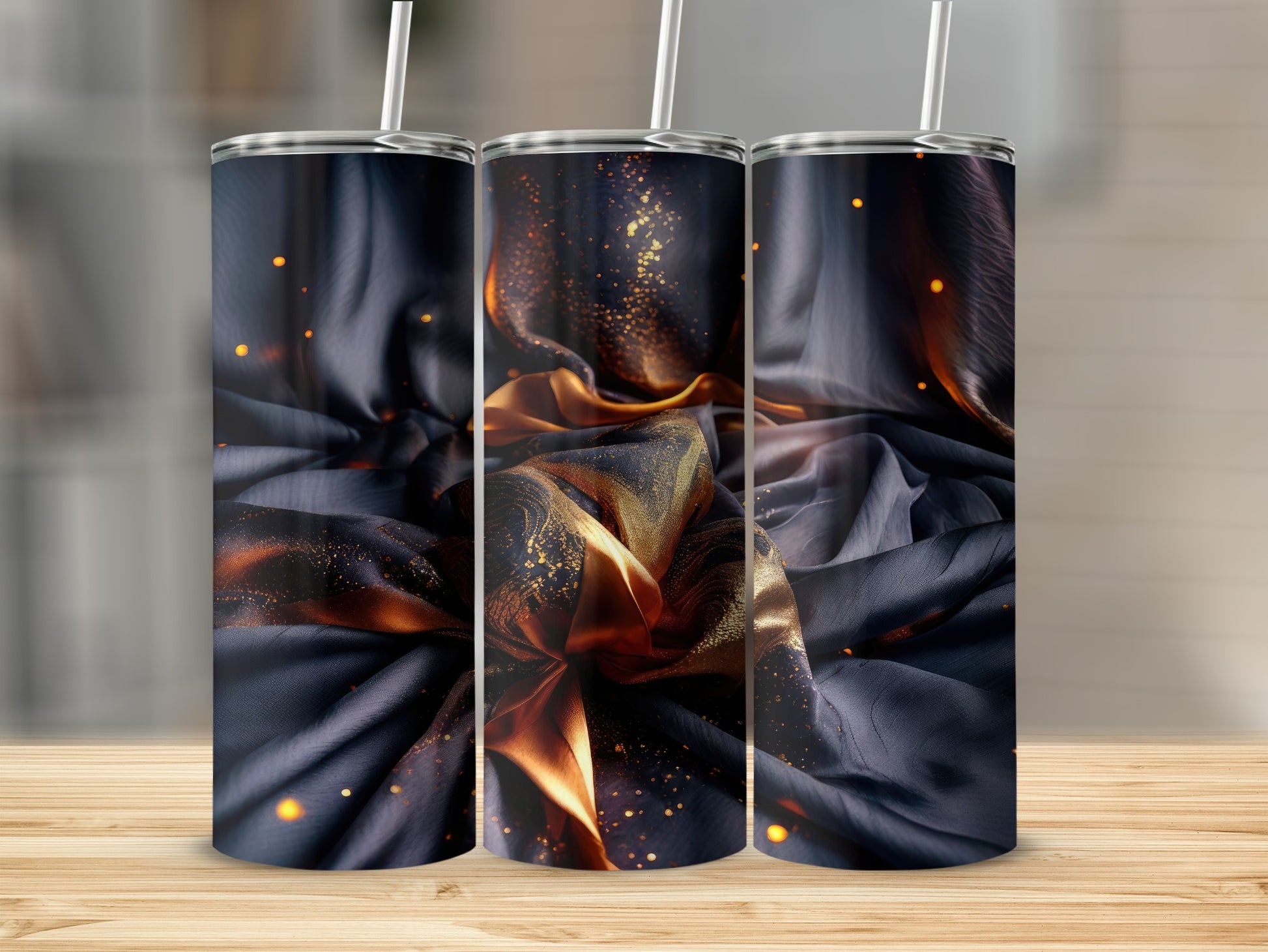 Three tumblers featuring abstract gold and black fabric design.