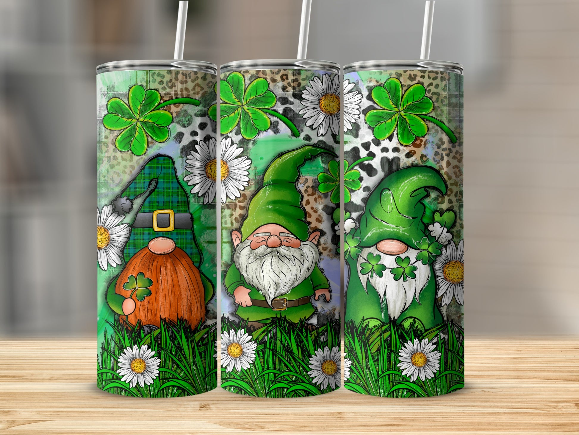 Three St. Patrick's Day gnomes with shamrocks and daisies on a tumbler.