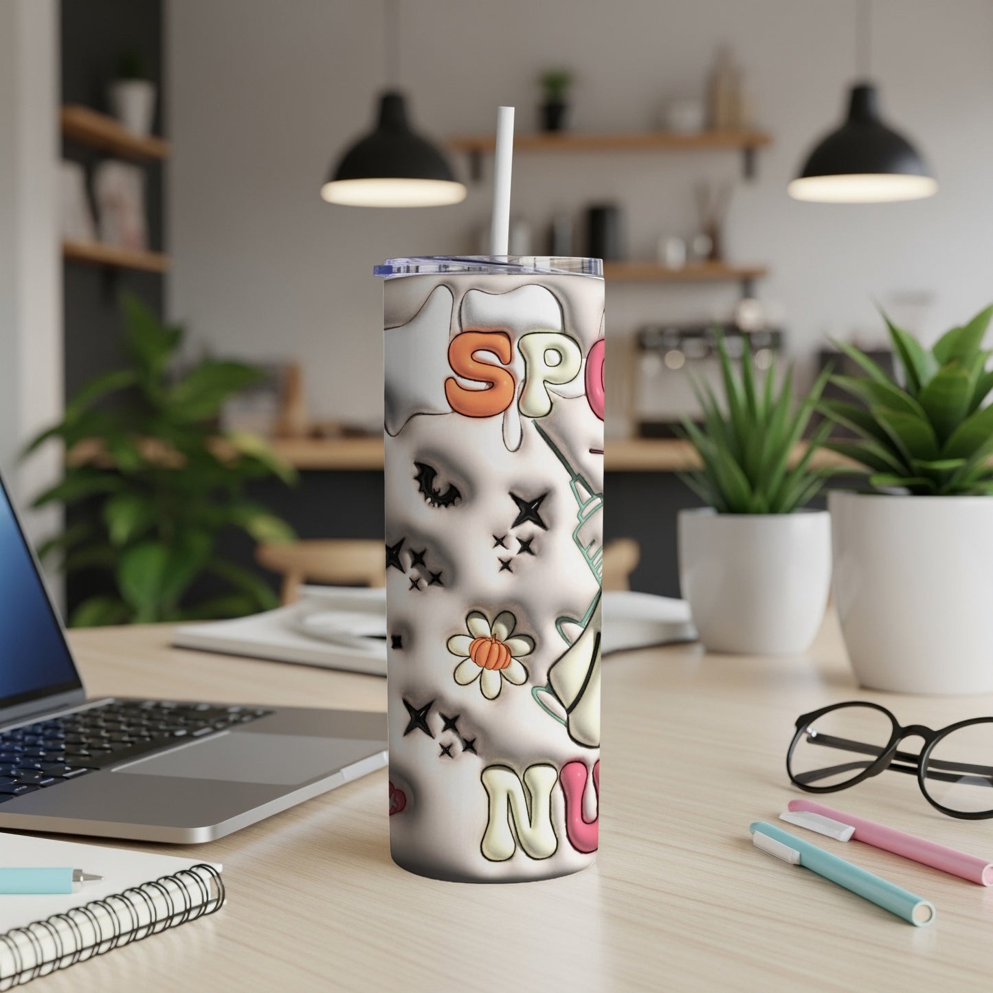 White tumbler with "Spooky Nurse" text, ghost, and unicorn graphics.