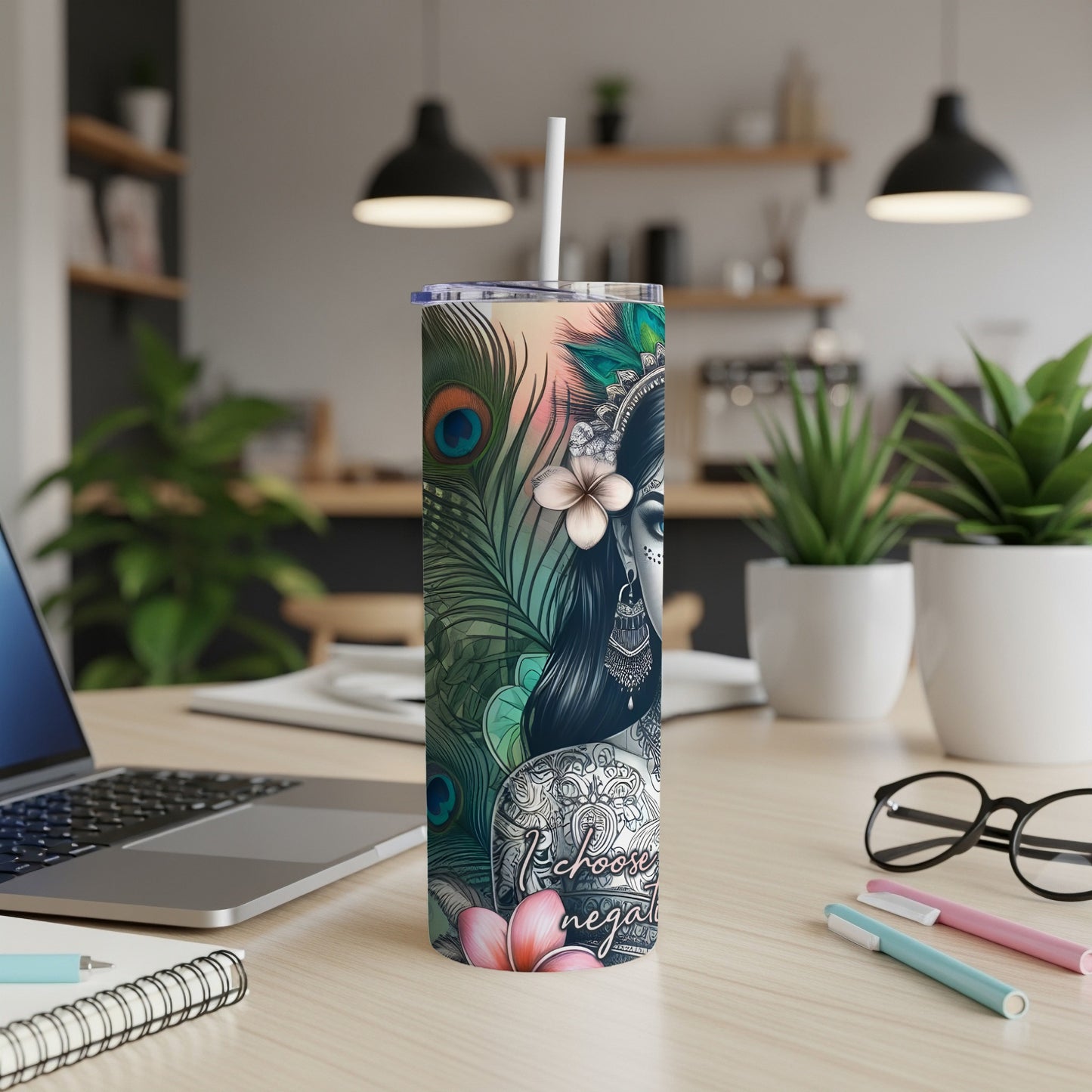 Kundalini yoga goddess artwork on a tumbler with peacock feathers and floral accents.