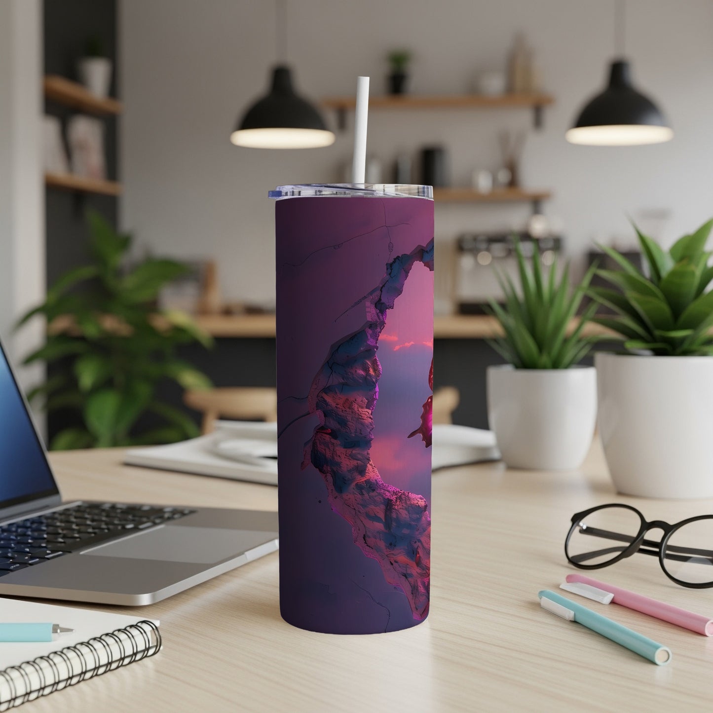 Purple tumbler with crackled abstract design, sitting on desk.