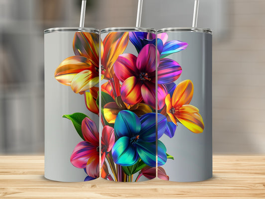 Three tumblers with vibrant, abstract floral designs and straws.