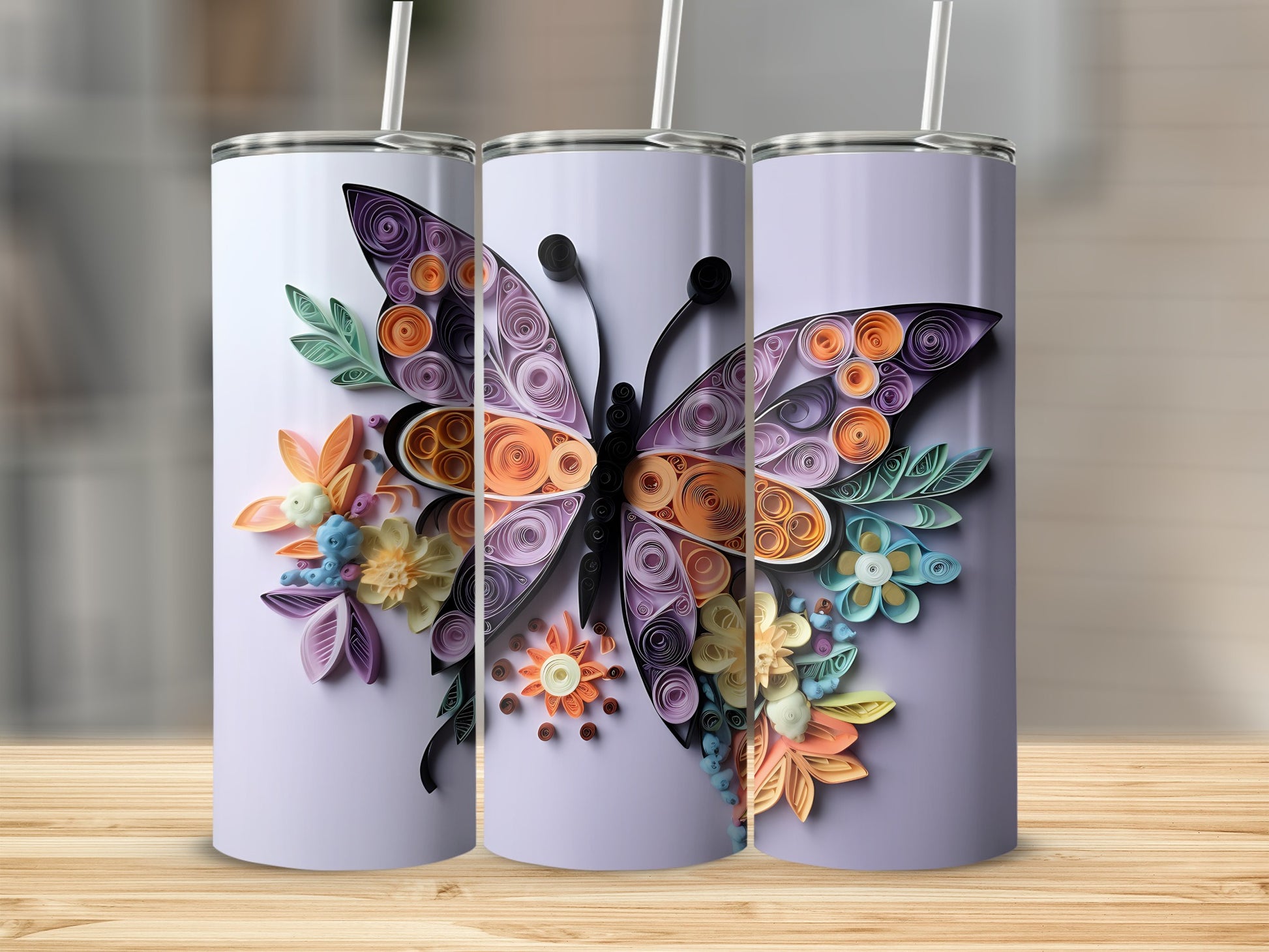 Three tumblers decorated with a quilled butterfly and floral designs in purple and orange.