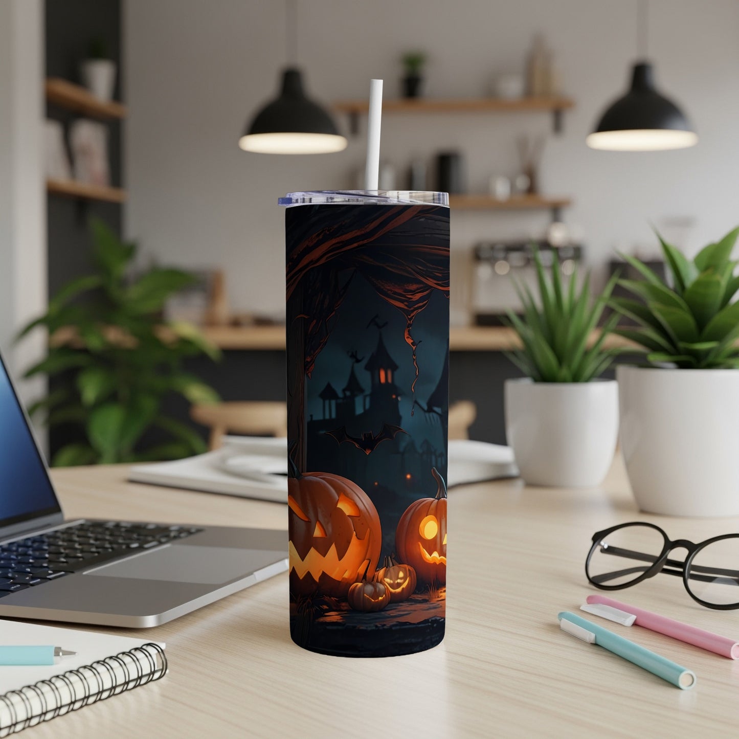 Tumbler with Halloween design: carved pumpkins, bats, and spooky castle.