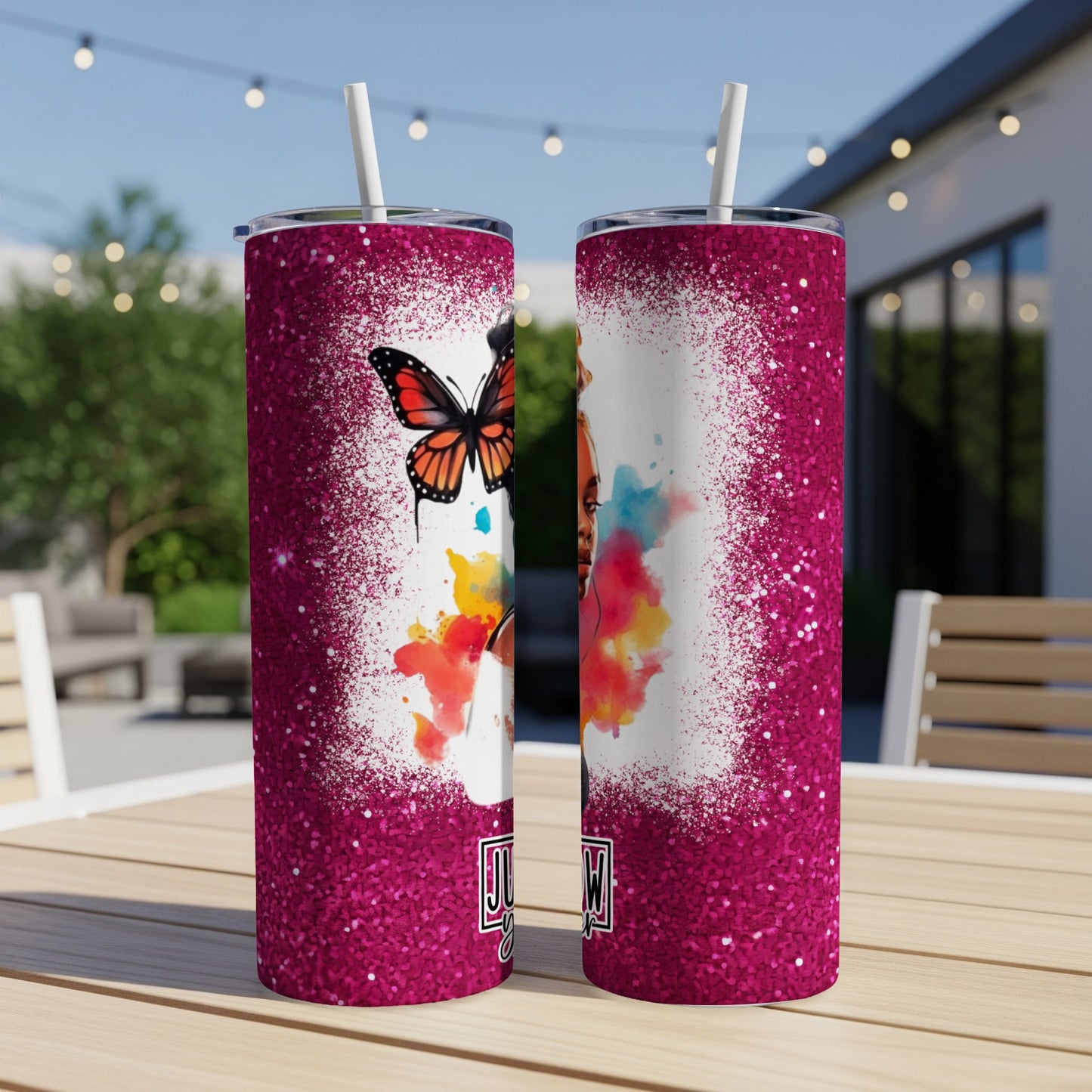 Tumbler with glitter border and portrait of a woman with a butterfly.