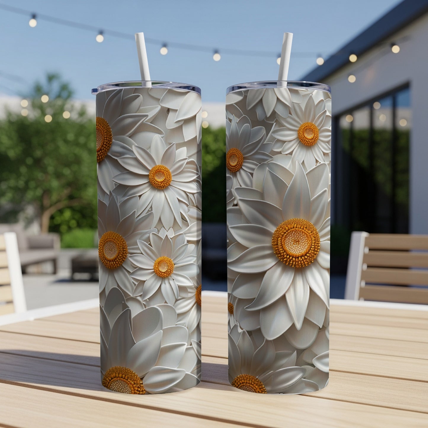 Two white daisy pattern tumblers with orange centers on a wooden table.