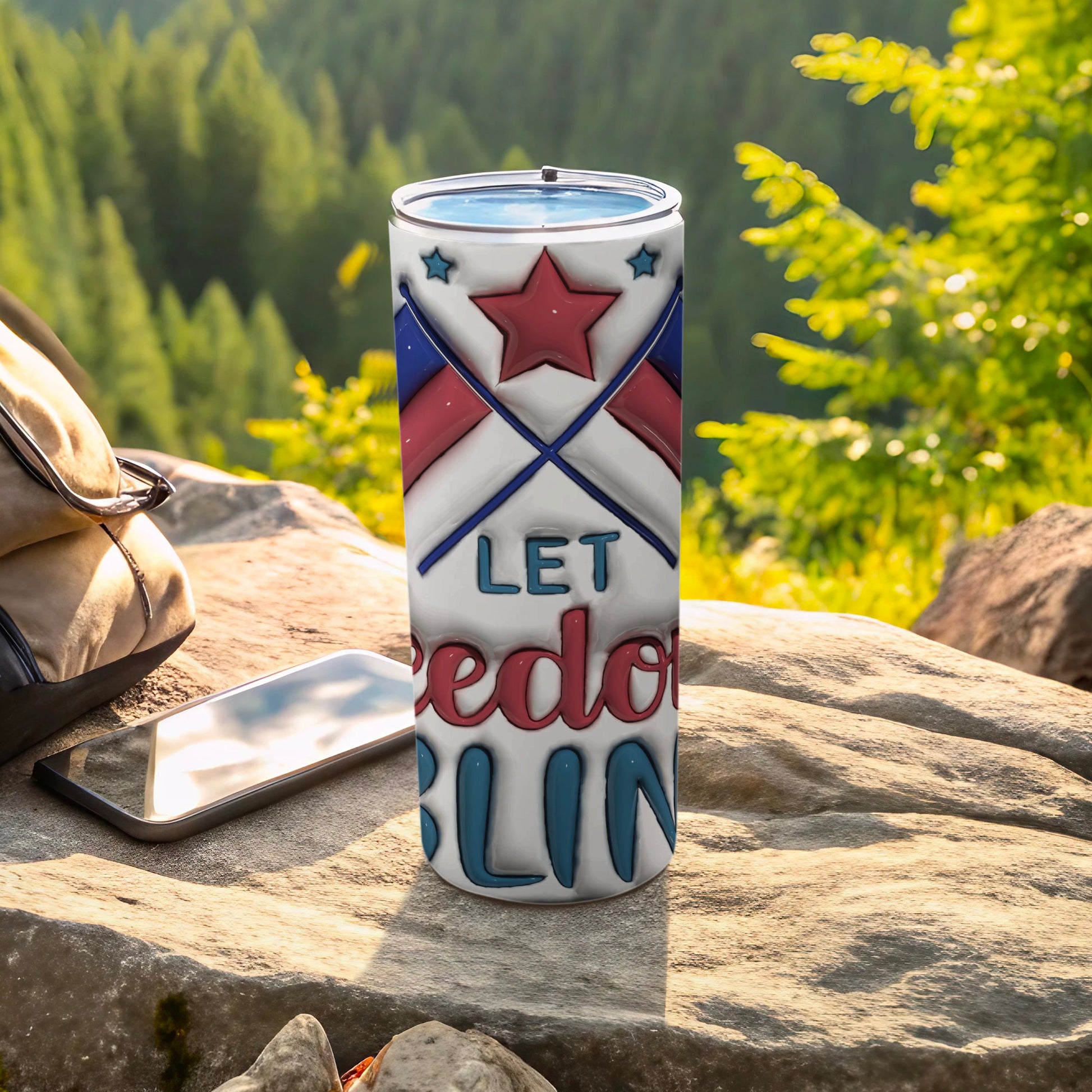 Red, white, and blue tumbler with "Let Freedom Ring" text and crossed flags.