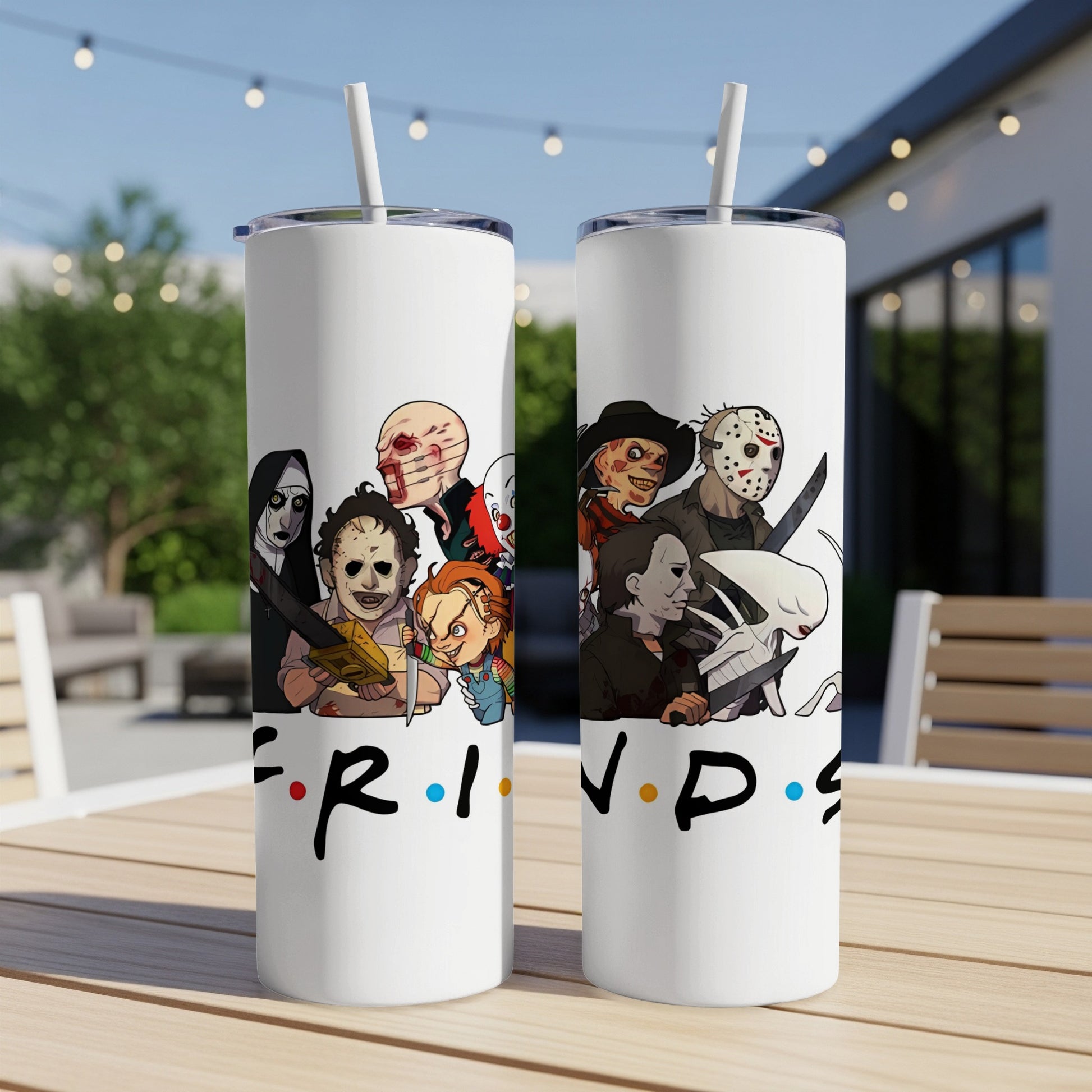 Two white tumblers featuring cartoon horror movie characters and the Friends logo.