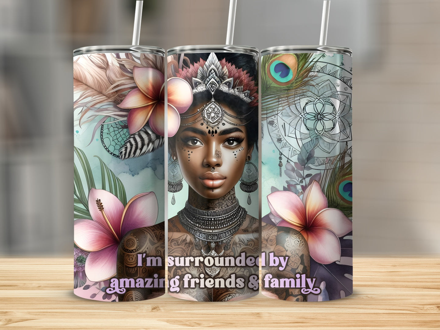 Tumbler with tattooed woman, flowers, and peacock feathers, "I'm surrounded by amazing friends & family".
