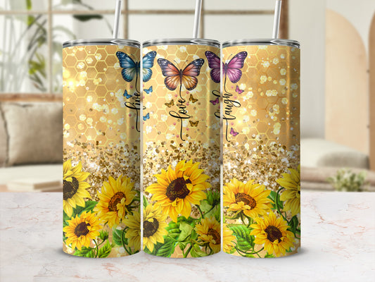 Sunflower and butterfly tumbler with "live, love, laugh" text.