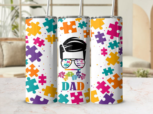 Colorful puzzle pieces surround "Autism Dad" text with sunglasses graphic.