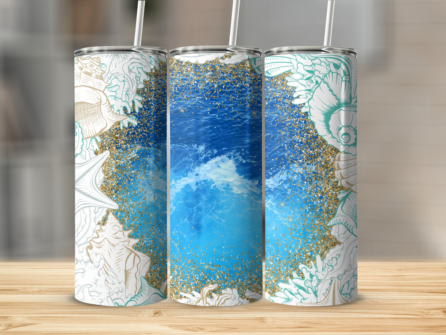 Three tumblers with ocean waves and seashell designs.