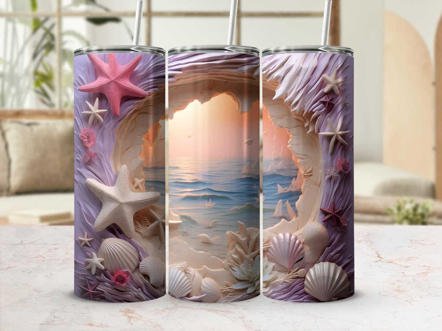 Three tumblers with a seashell and ocean cave design.