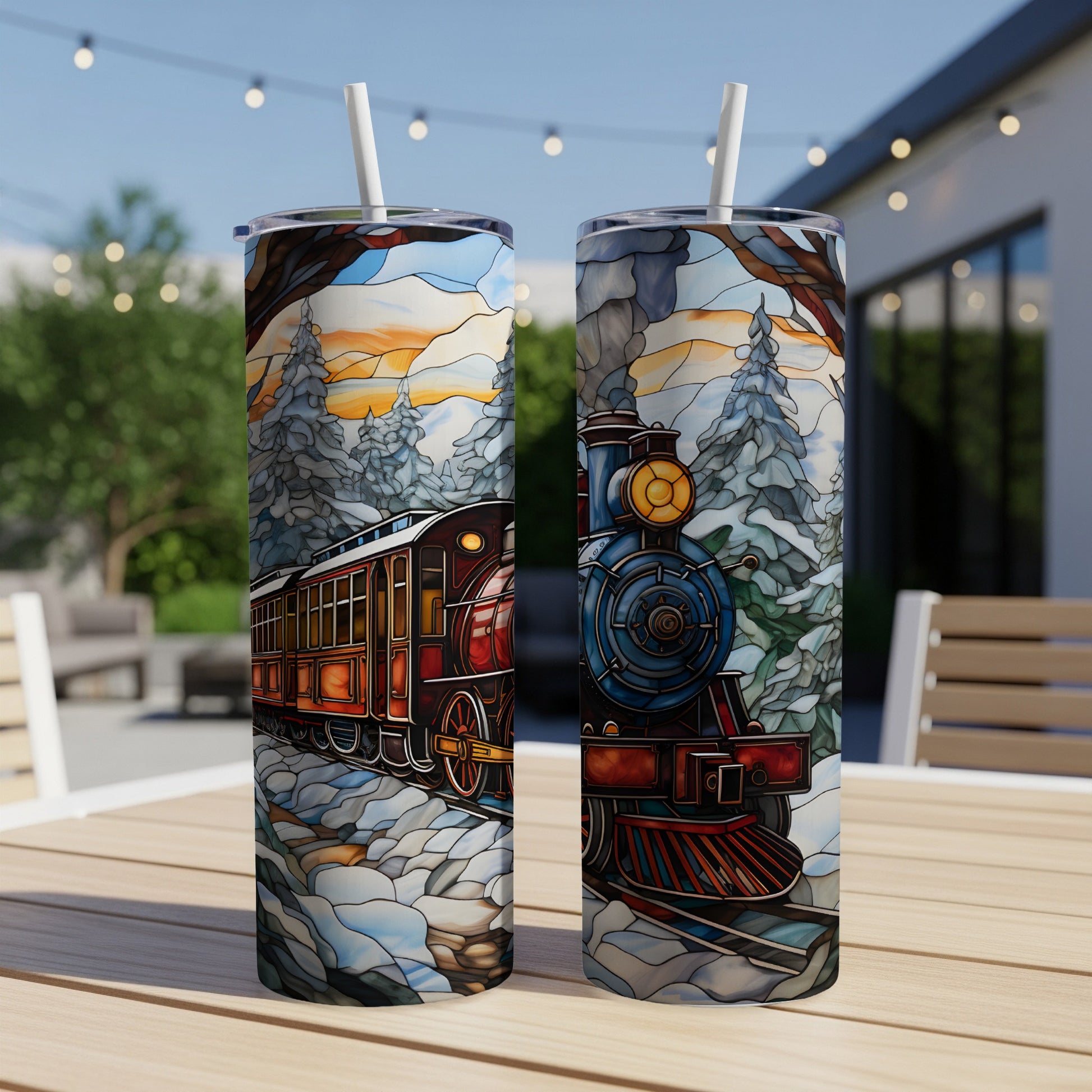 Winter train scene on two insulated tumblers with straws.